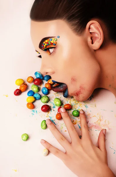 The girl with candies — Stock Photo, Image