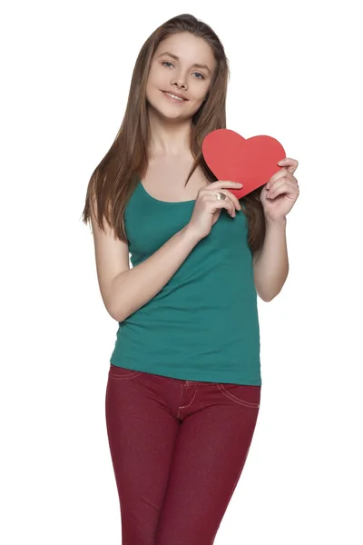 Portrait of young female holding heart shape isolated on white background — Stock Photo, Image