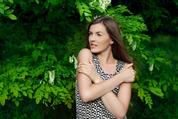 Portrait of a beautiful girl with crossed hands outdoor — Stock Photo, Image