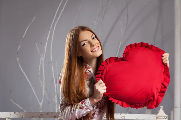 Woman holding a red big heart — Stock Photo, Image