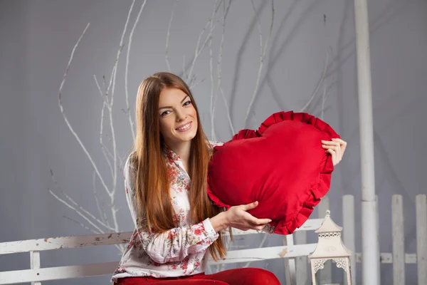 Woman holding a red big heart — Stock Photo, Image