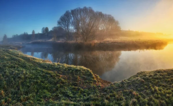 Fog over the river in the early morning on an autumn day. Nature of Ukraine