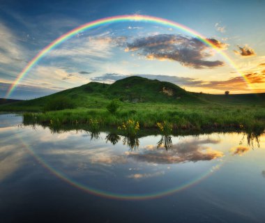 Landscape with a Rainbow on the River in Spring. colorful morning. nature of Ukraine