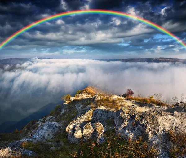 colorful rainbow over river canyon. nature of Ukraine