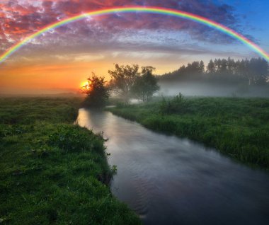 Landscape with a Rainbow on the River in Spring. colorful morning. nature of Ukraine