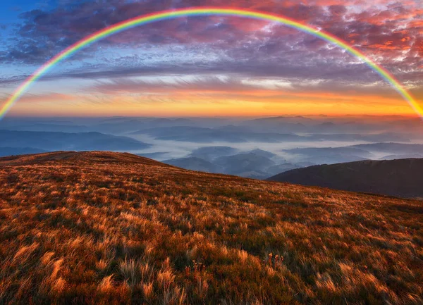 Rainbow over the Mountains. autumn morning in the Carpathians. Nature of Ukraine