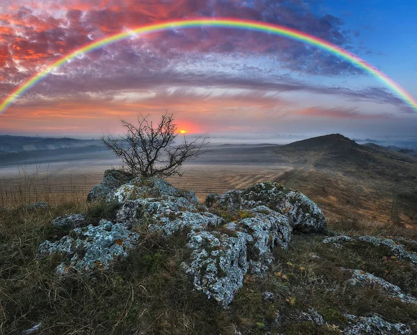 Rainbow with clouds over the canyon. autumn landscape. nature of Ukraine