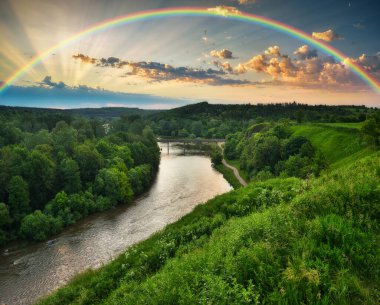 Landscape with a Rainbow on the River in Spring. colorful morning. nature of Ukraine
