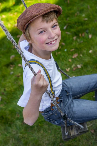 Boy on swing — Stock Photo, Image