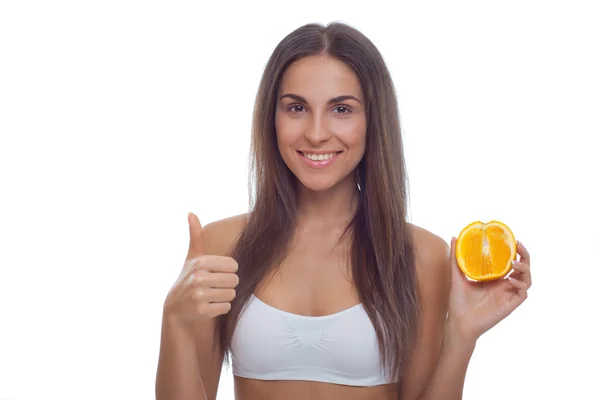 Lachende mooie jonge vrouw met fruit — Stockfoto