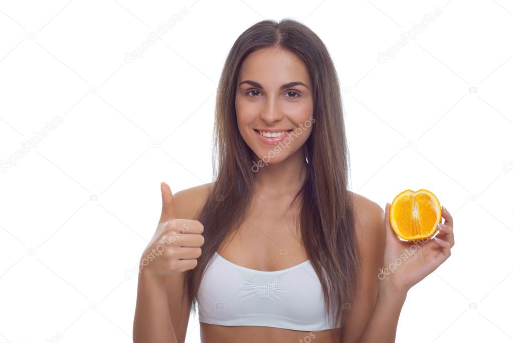 Smiling beautiful young woman with fruit