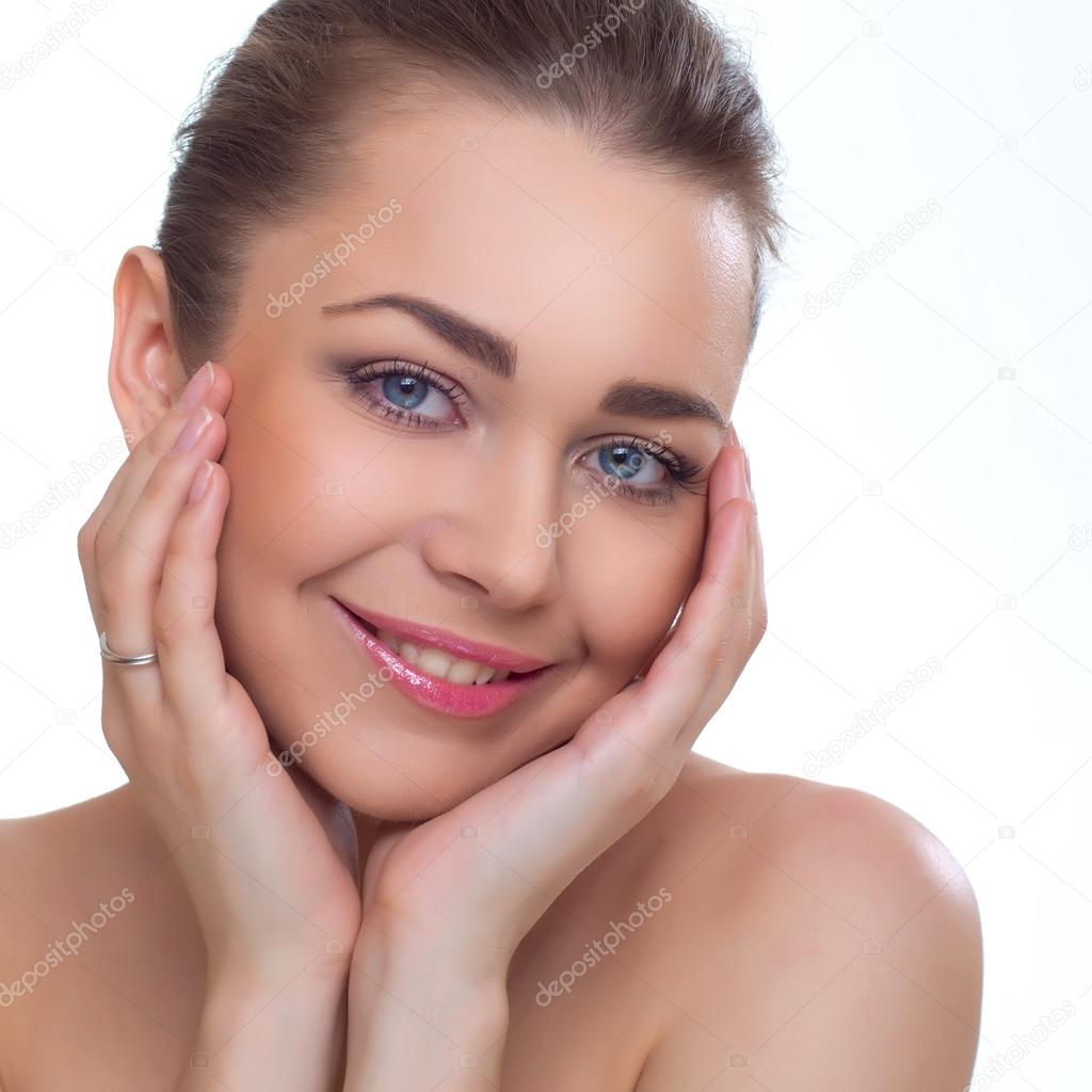 Beautiful young woman face over white background.