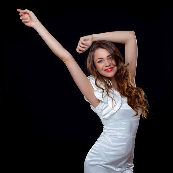 Portrait of a beautiful dancing woman with long curly hair — Stock Photo, Image