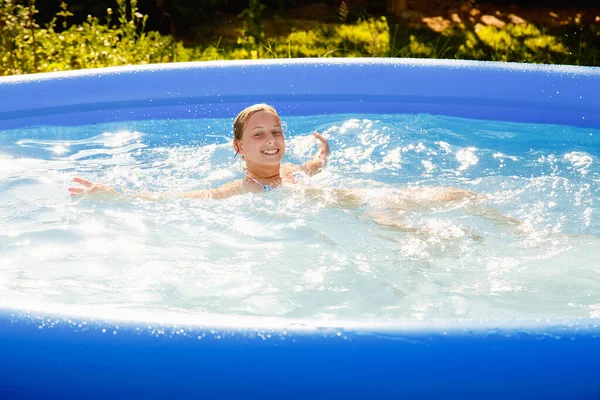 Child Water Girl Splashes Inflatable Pool Garden Sunny Summer Day — Fotografia de Stock