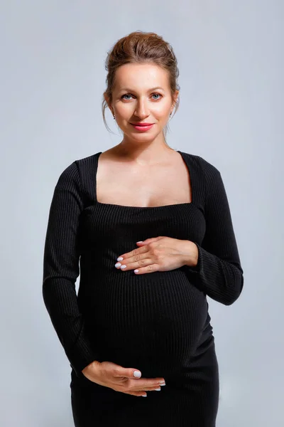 Portrait Pregnant Woman Tight Black Dress Gray Background Woman Gently — Stock Photo, Image