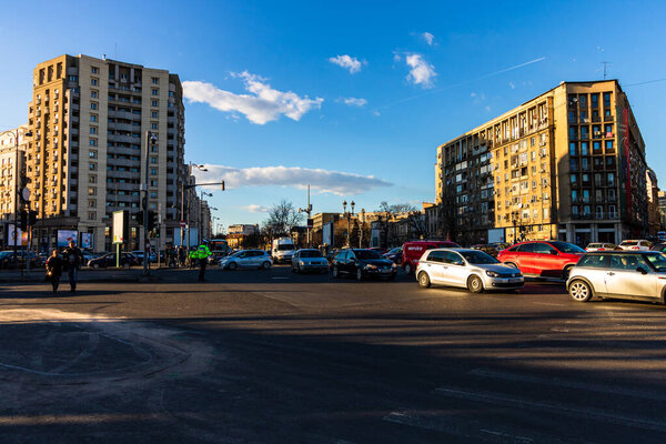 Cars in traffic at rush hour in downtown area of the city. Car pollution, traffic jam in the morning and evening in the capital city of Bucharest, Romania, 2021