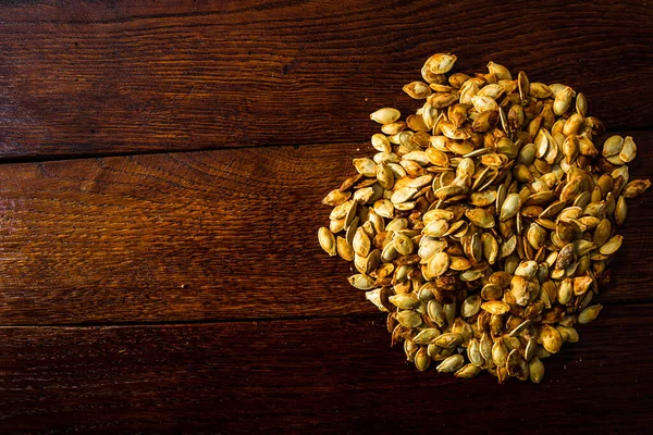 Roasted Salty Pumpkin Seeds Wooden Table — Stock Photo, Image