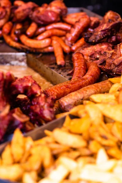 stock image Grilling tasty food on barbecue. Steak, sausages on grill at food festival