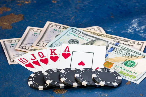 Stacks of poker chips with money and cards