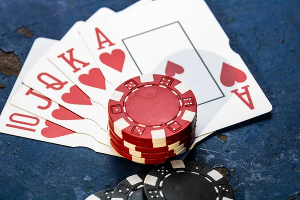 Stacks of poker chips with money and cards