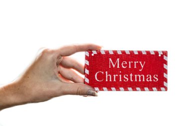 Beyaz arka planda Noel süsleri tutmak