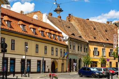 People and tourists wandering in old town Sibiu, Romania, 2022