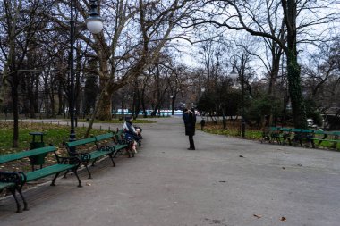People and tourists wander the streets of the Bucharest Old Town, Romania, 2022
