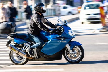 Motorcyclist on motorbike in traffic in Bucharest, Romania, 2022