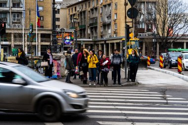 People and tourists wander the streets of the Bucharest Old Town, Romania, 2022