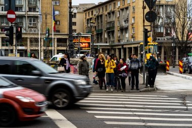 People and tourists wander the streets of the Bucharest Old Town, Romania, 2022