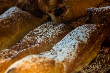 Freshly made pastry in pastry window shop