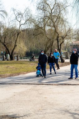 People and tourists wander the streets of the Bucharest Old Town, Romania, 2022