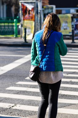 People and tourists wander the streets of the Bucharest Old Town, Romania, 2022