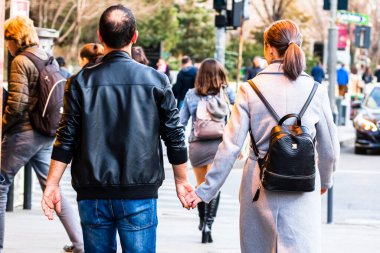 People and tourists wander the streets of the Bucharest Old Town, Romania, 2022