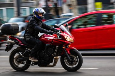 Motorcyclist on motorbike in traffic in Bucharest, Romania, 2022