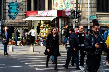 People and tourists wander the streets of the Bucharest Old Town, Romania, 2022
