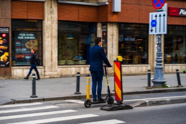 People and tourists wander the streets of the Bucharest Old Town, Romania, 2022