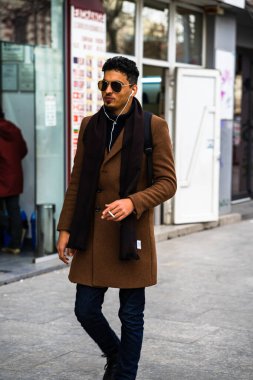 People and tourists wander the streets of the Bucharest Old Town, Romania, 2022