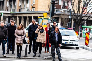 People and tourists wander the streets of the Bucharest Old Town, Romania, 2022