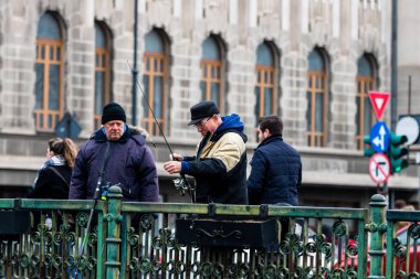 People and tourists wander the streets of the Bucharest Old Town, Romania, 2022