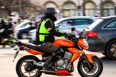 Motorcyclist on motorbike in traffic in Bucharest, Romania, 2022