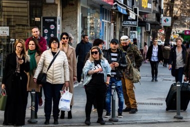 People and tourists wander the streets of the Bucharest Old Town, Romania, 2022