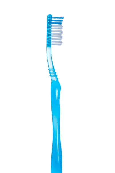 beyaz zemin üzerinde bir diş fırçası