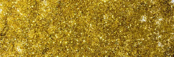 Christmas background with gifts, gold ribbon and gold Christmas decorations, glitter. Christmas background, top view. Copy space. Banner. — Stock Photo, Image