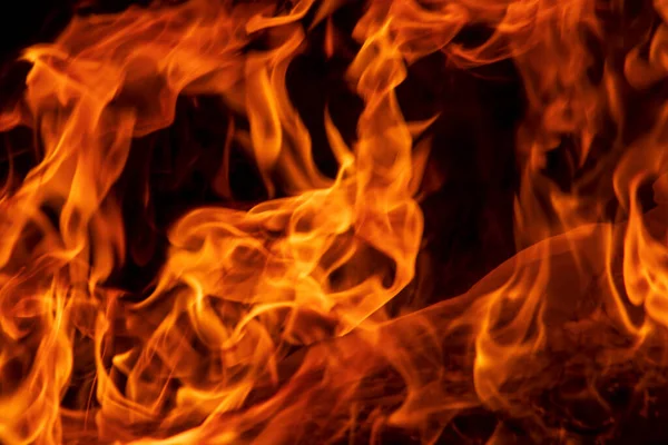 Abstrakte Flamme, Feuerflammenstruktur, Hintergrund. Feuerzungen auf dunklem Hintergrund. Stockfoto