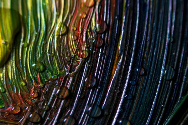 Színes színes festék borított vízcseppek, téma tapéta háttér. Szelektív fókusz. Multicolor absztrakció. Fantasztikus hipnotikus felület. Absztrakt minta közelkép, textúra folyékony festék — Stock Fotó