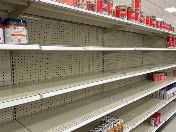Empty shelves at a Target store in suburban Chicago show how widespread the baby formula shortage is in spring 2022.