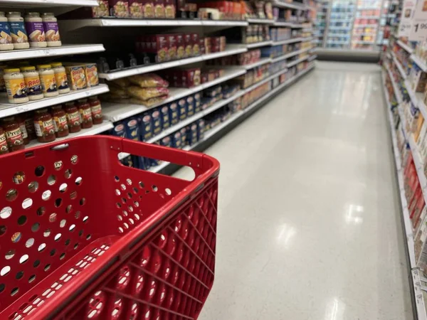 Red Shopping Cart Going Blurred Aisle Target Store — Stock Photo, Image