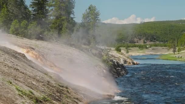 Yellowstone 4K cinematic landscape with hot spring stream flowing in blue river — Stock Video