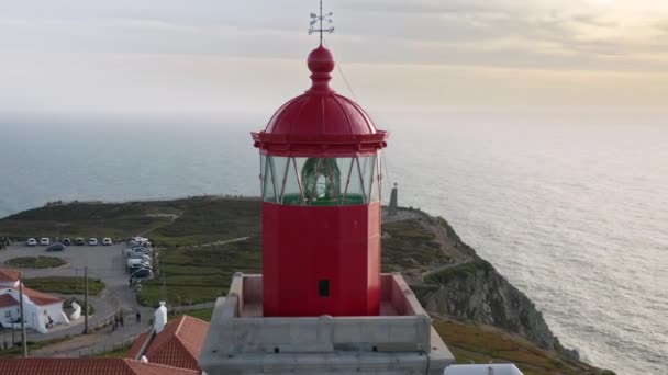A motion background with a lighthouse complex on a tip of a cape — Stock Video